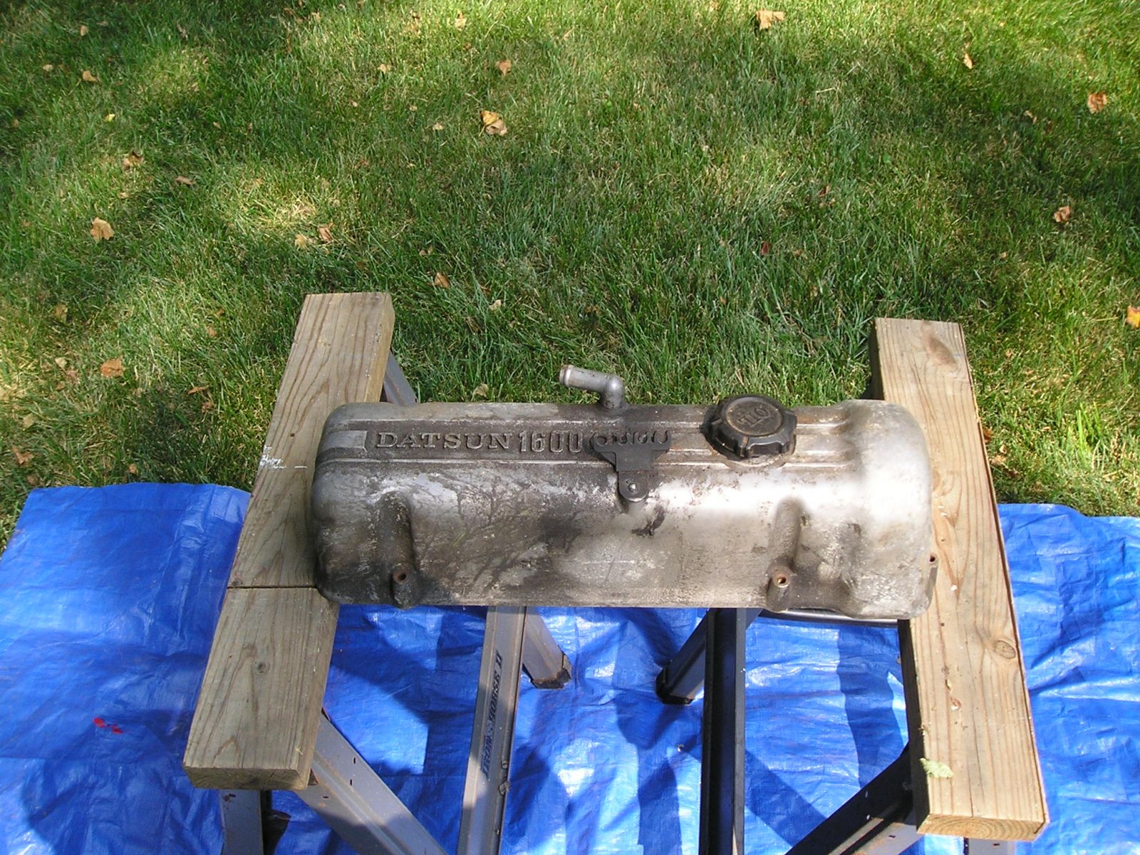 early L series valve cover with "DATSUN 1600 OHC" Insignia